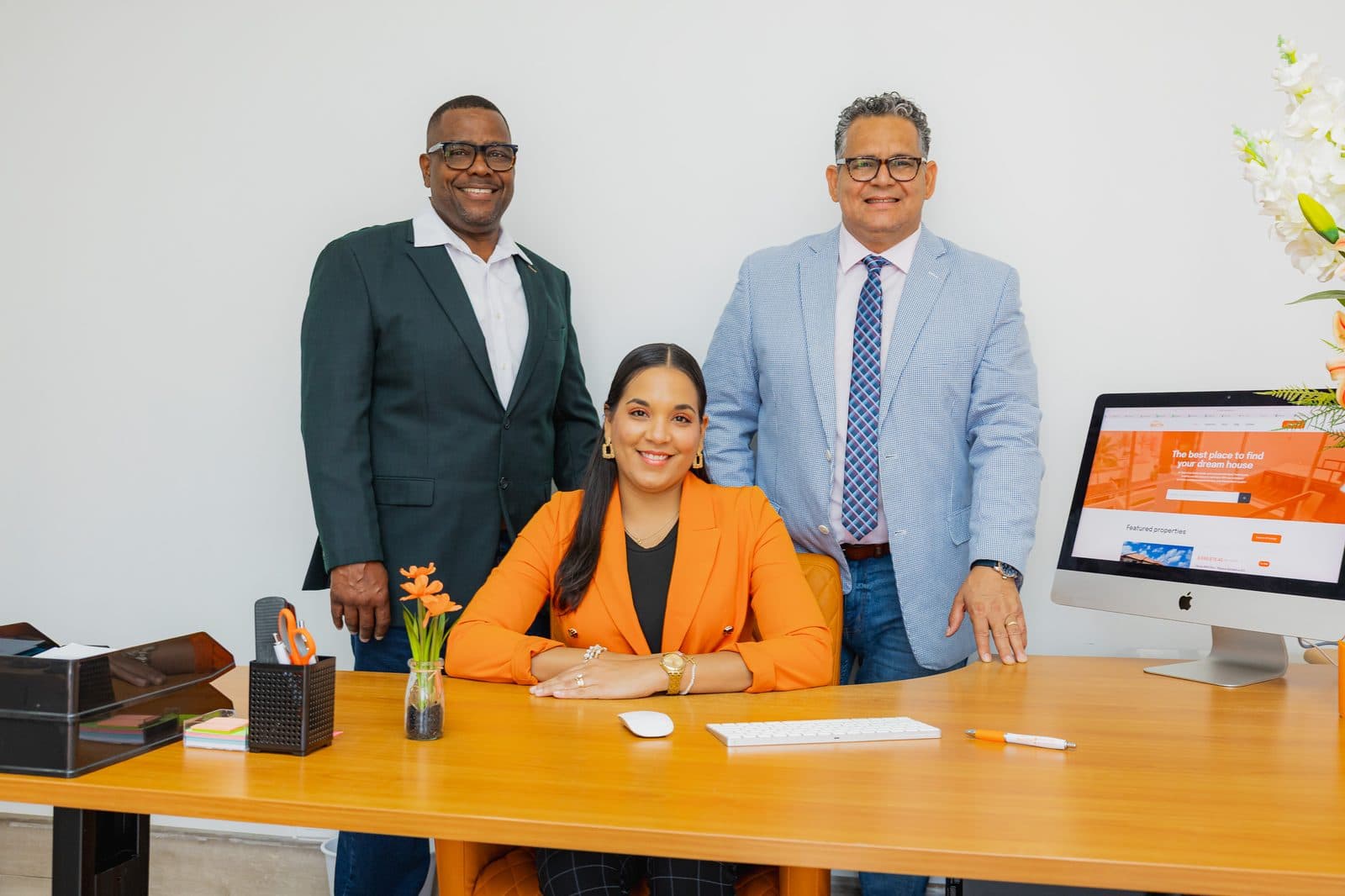 The Objective Realty team at their office in Aruba